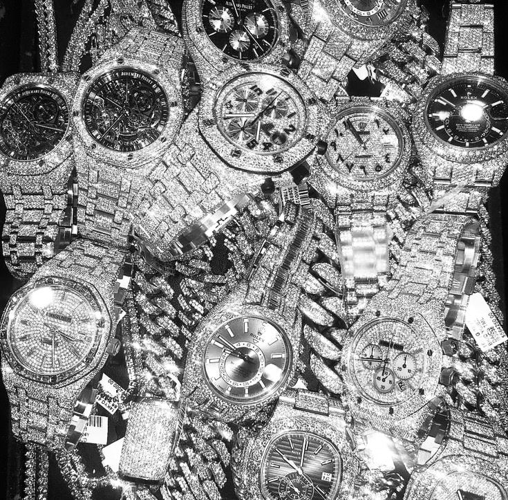 Multiple watches with intricate designs on a black background